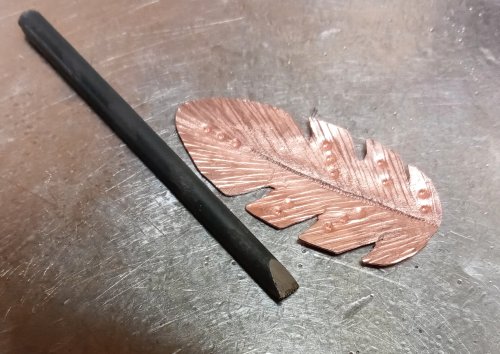 Judy Larson's Copper Feather Earrings Remodel Into Cuff - , Metalwork, Cutting, Cutting Tool, Cutters, Oxidizing Wire, Oxidizing, Antiquing Wire, Antiquing, Stamping, Stamps, Texturing, Butane Torch, Soldering, Solder, Design, sanding, filing, polishing, The stamp was modified with a triangular file